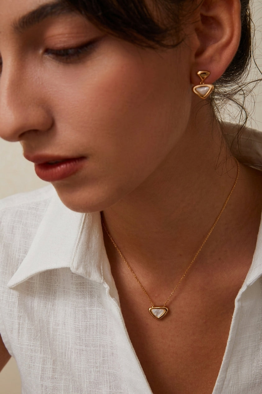 Triangle mother-of-pearl necklace and earrings on model
