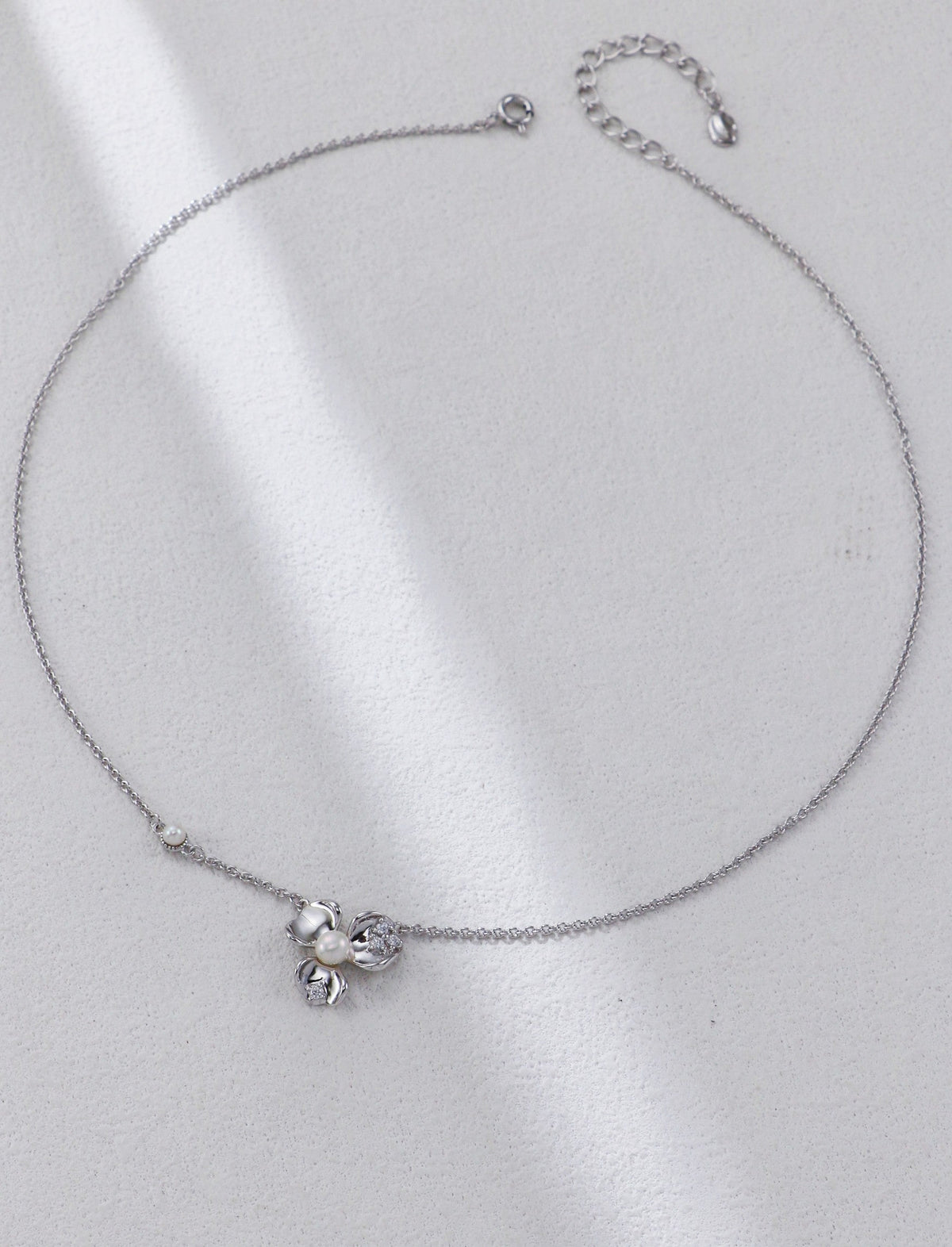 Full length of the Botanical necklace in sterling silver with extender chain