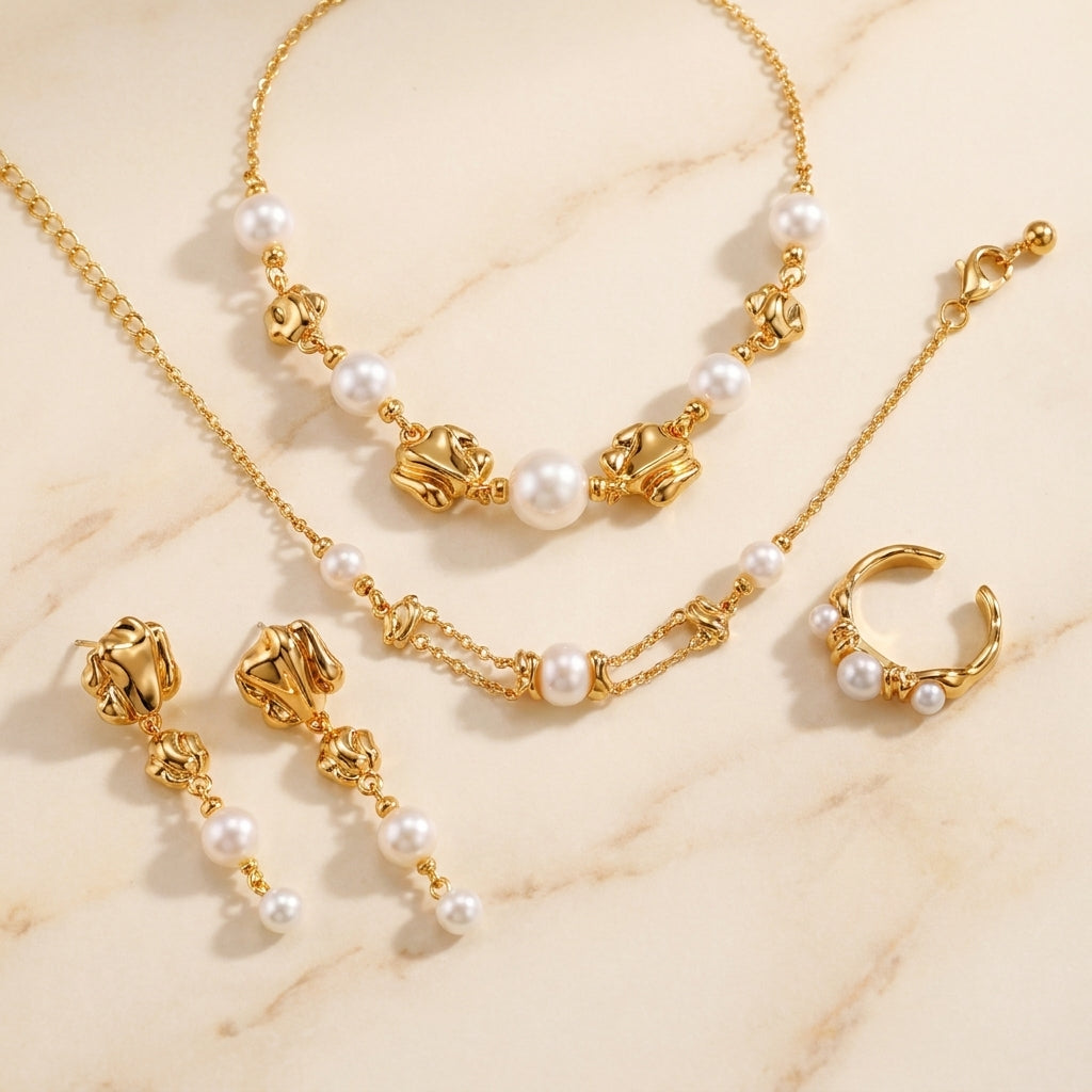 Sterling Silver Molten Gold Pearl Set — necklace, earrings, bracelet and ring flat-lay