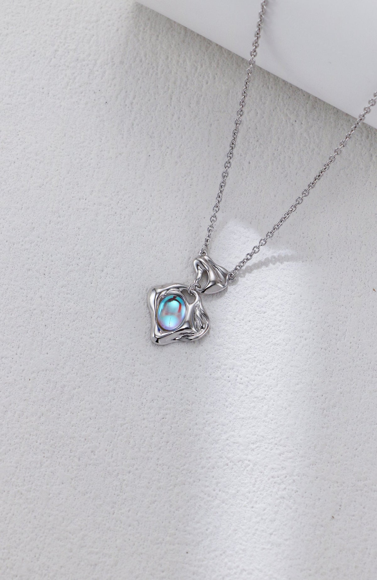Close-up of the moonstone in its molten sterling silver setting