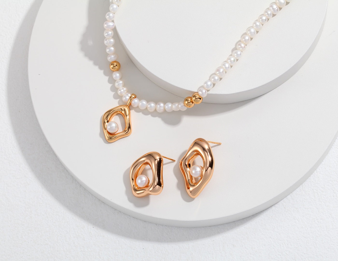 Avant-Garde Sterling Silver Pearl Necklace and Earring Set